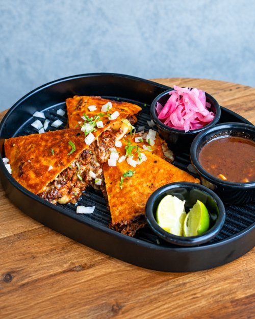 Crispy birria tacos with dipping consommé