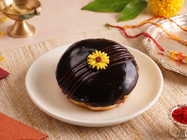 Rakhi Sunshine shell doughnut filled with salted caramel and decorated with a festive flower design